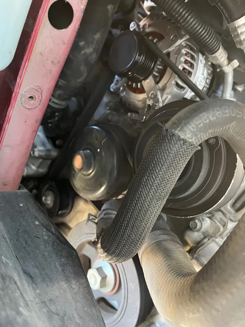 Belt tensioner and pulleys on a Corona call, the circled part is what we found in Corona, CA
