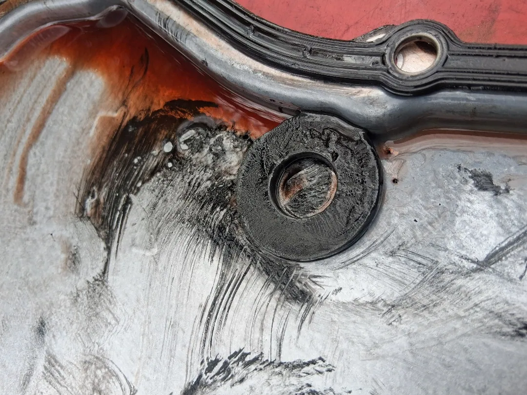 Oil pan sealing face scraped back to clean metal before the new gasket goes on in Jurupa Valley, CA